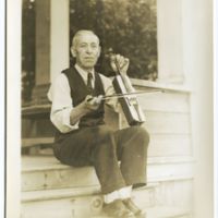 Bedros Haroutunian playing kamanche, portrait, photograph